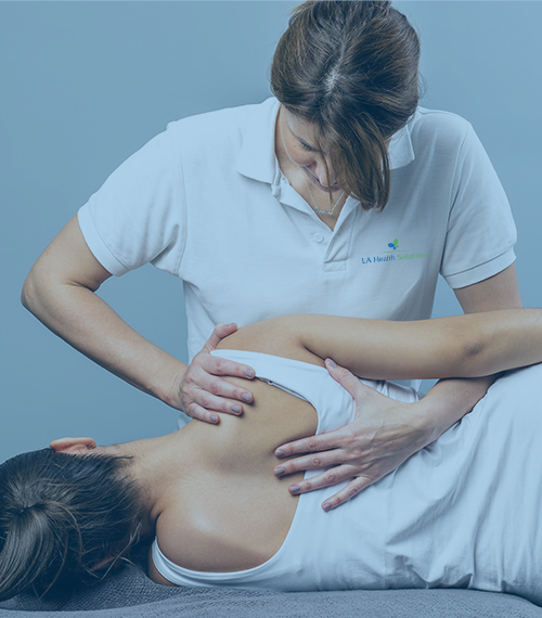 Chiropractic Services (Image of LA Health Solutions' Team Member stretching patient back)