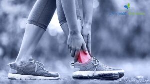Differences Between A Sprain And Strain (Runner With hurt Ankle Image)
